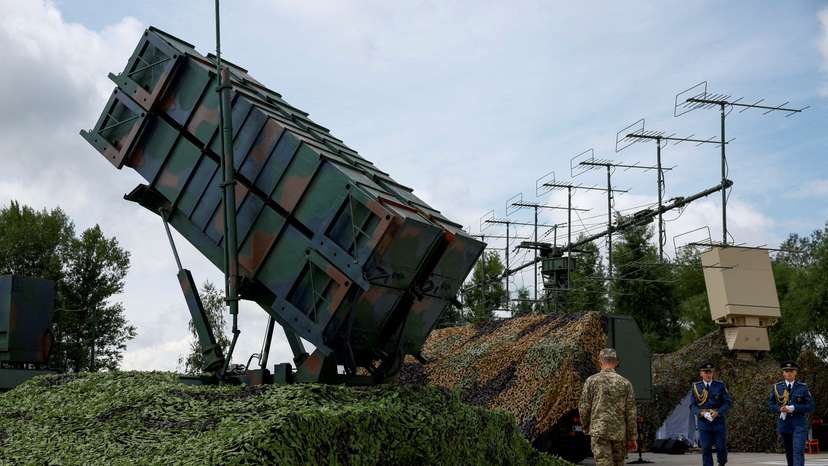 FILE PHOTO: Ukrainian service members walk next to a launcher of a Patriot air defence system an undisclosed location in Ukraine