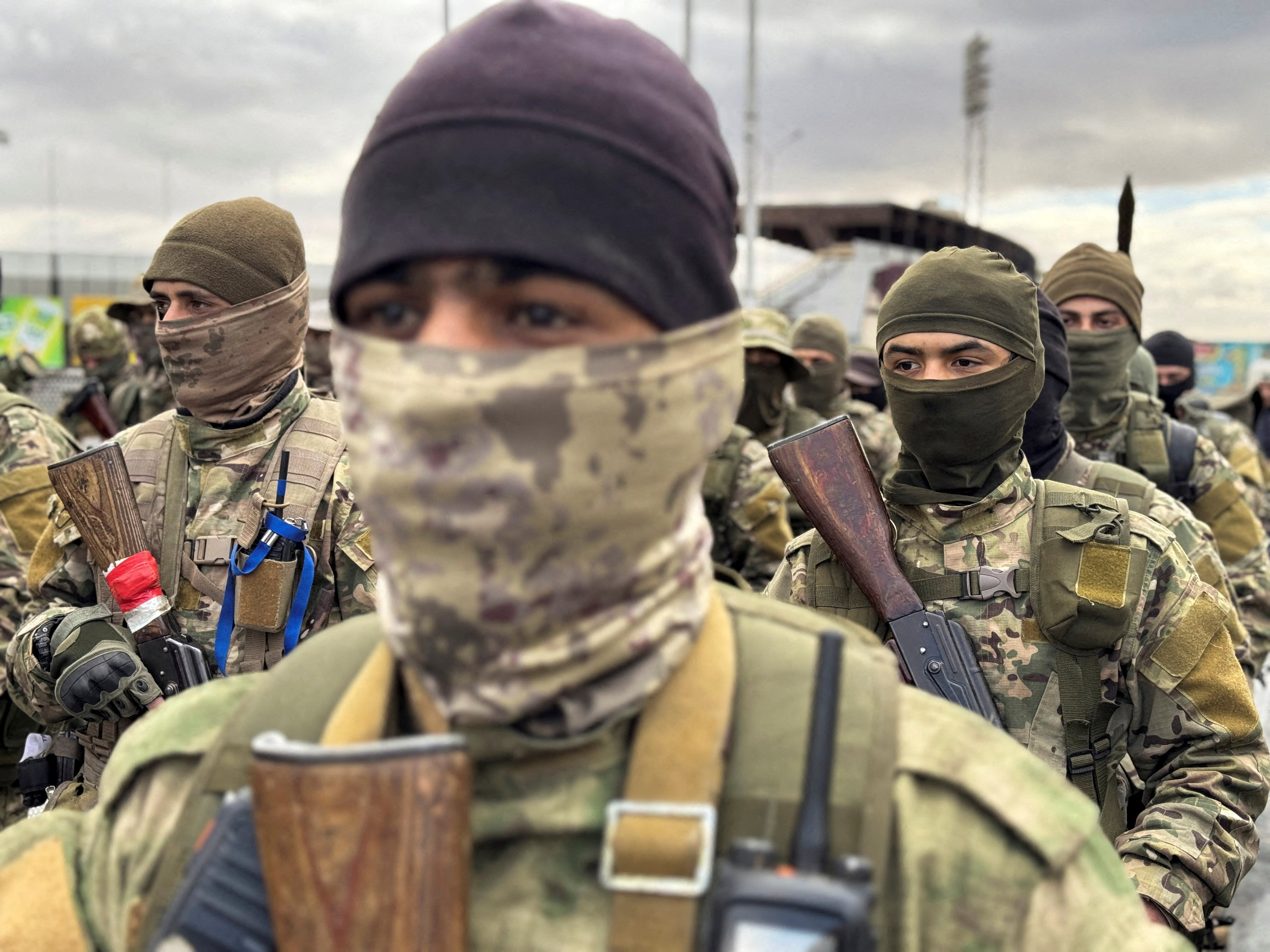 FILE PHOTO: Khaled Brigade, a part of Hay'at Tahrir al-Sham (HTS), hold a military parade, in Damascus