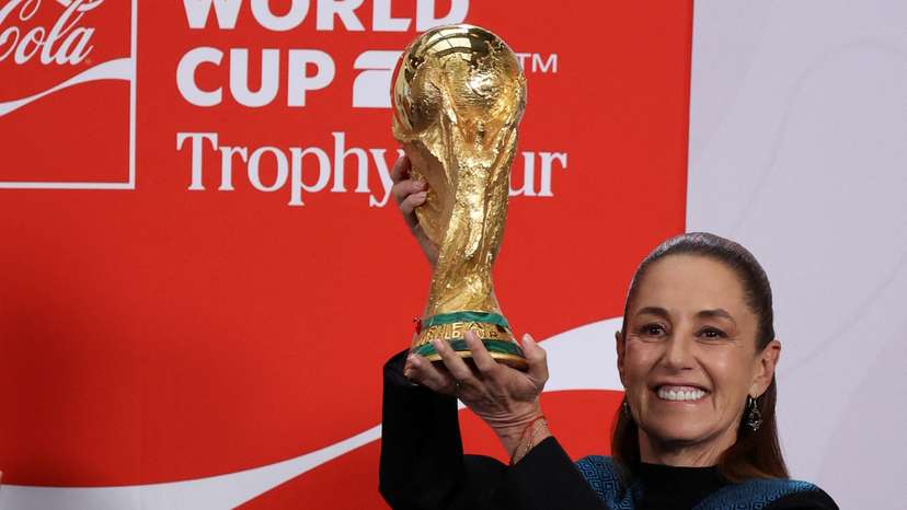 Mexican President Claudia Sheinbaum holds FIFA World Cup trophy at National Palace