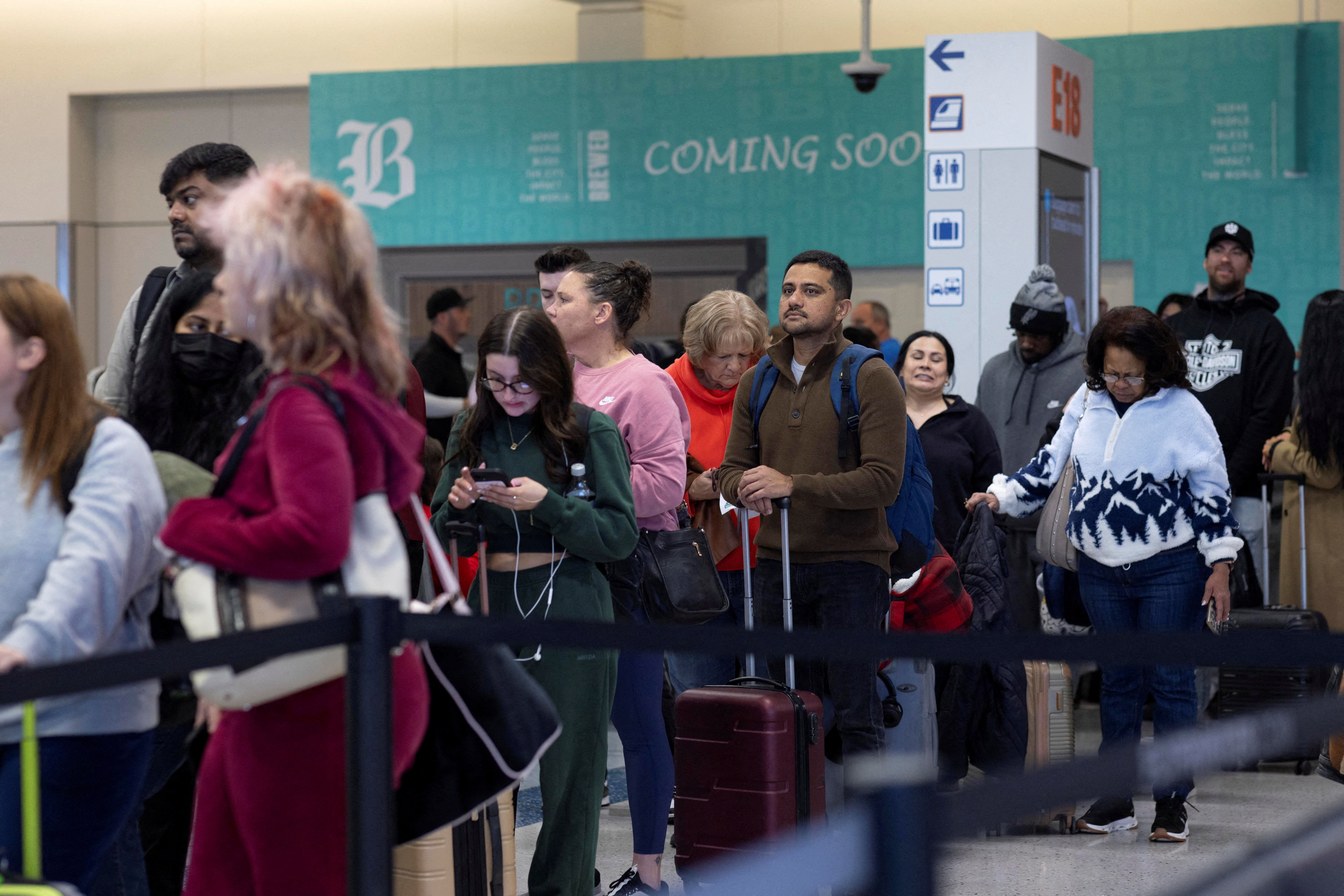FILE PHOTO: Travellers at Dallas Fort Worth International Airport