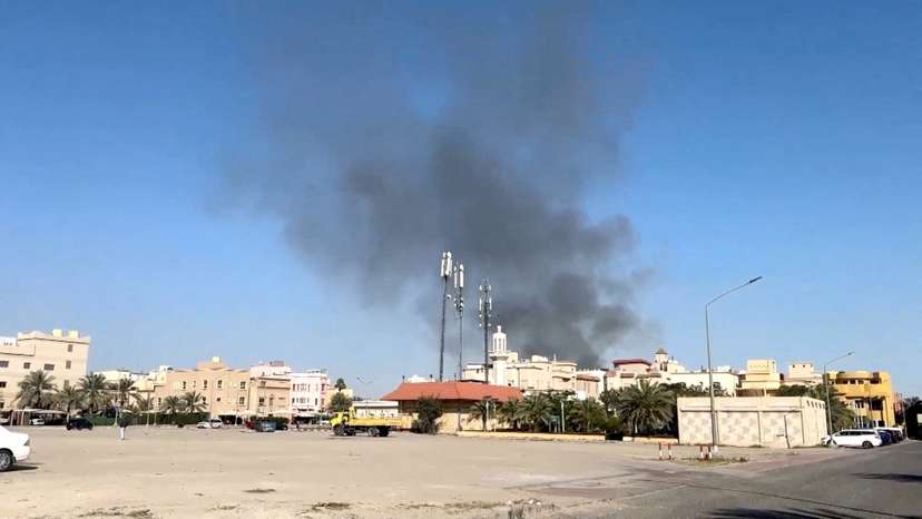 Smoke rises from an area surrounding U.S. Embassy, in Bayan