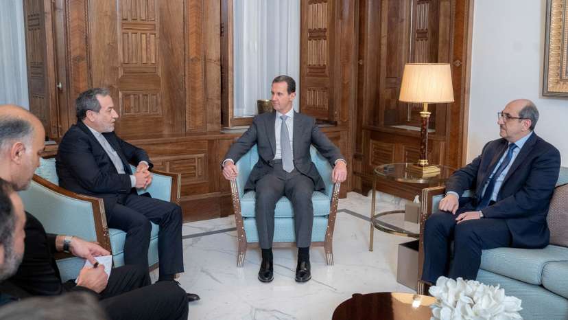 Syria's President Bashar al-Assad meets with Iran's Foreign Minister Abbas Araghchi, in Damascus