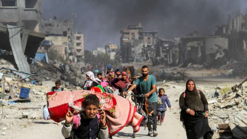 Displaced Palestinians flee the northern part of Gaza amid an Israeli military operation, in Gaza City