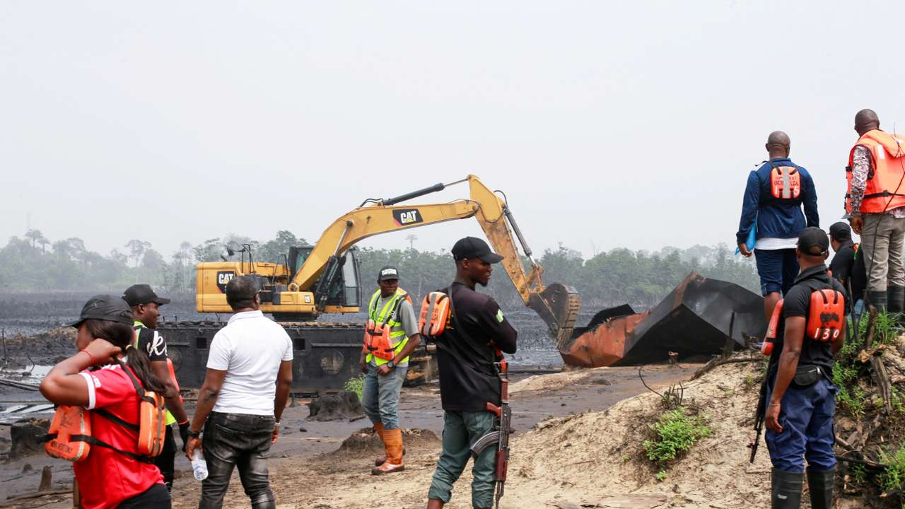 FILE PHOTO: Machinery is used to destroy several implements used by the illegal artisanal crude oil workers in the Niger delta area of Bakana ii illegal camp in Okrika