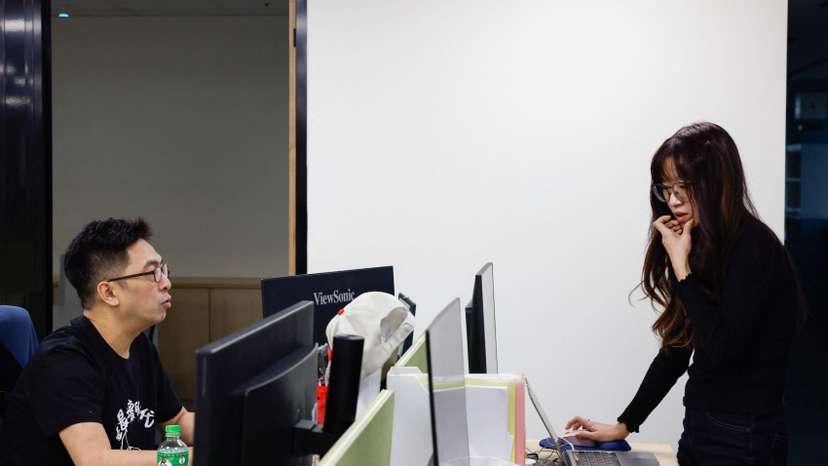 Shirley Leung and Edward Li at work in their office in Taipei