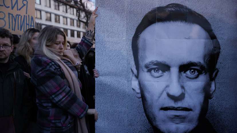 People demonstrate following the death of Russian opposition leader Alexei Navalny, in Warsaw