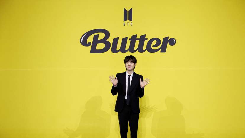 FILE PHOTO: K-pop boy band BTS member Suga poses for photographs during a photo opportunity promoting their new single 'Butter' in Seoul