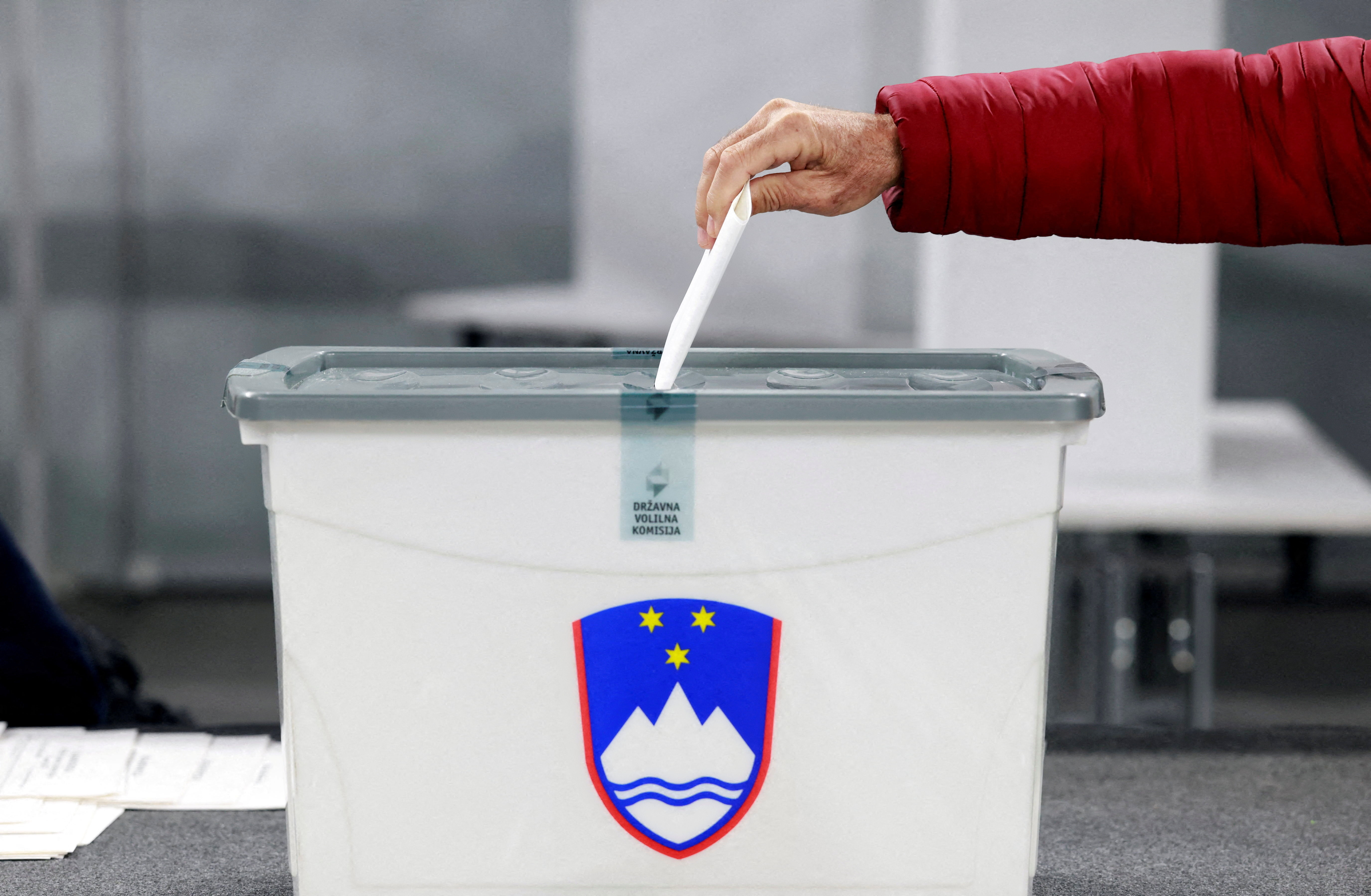 A person votes early in the Slovenian National elections