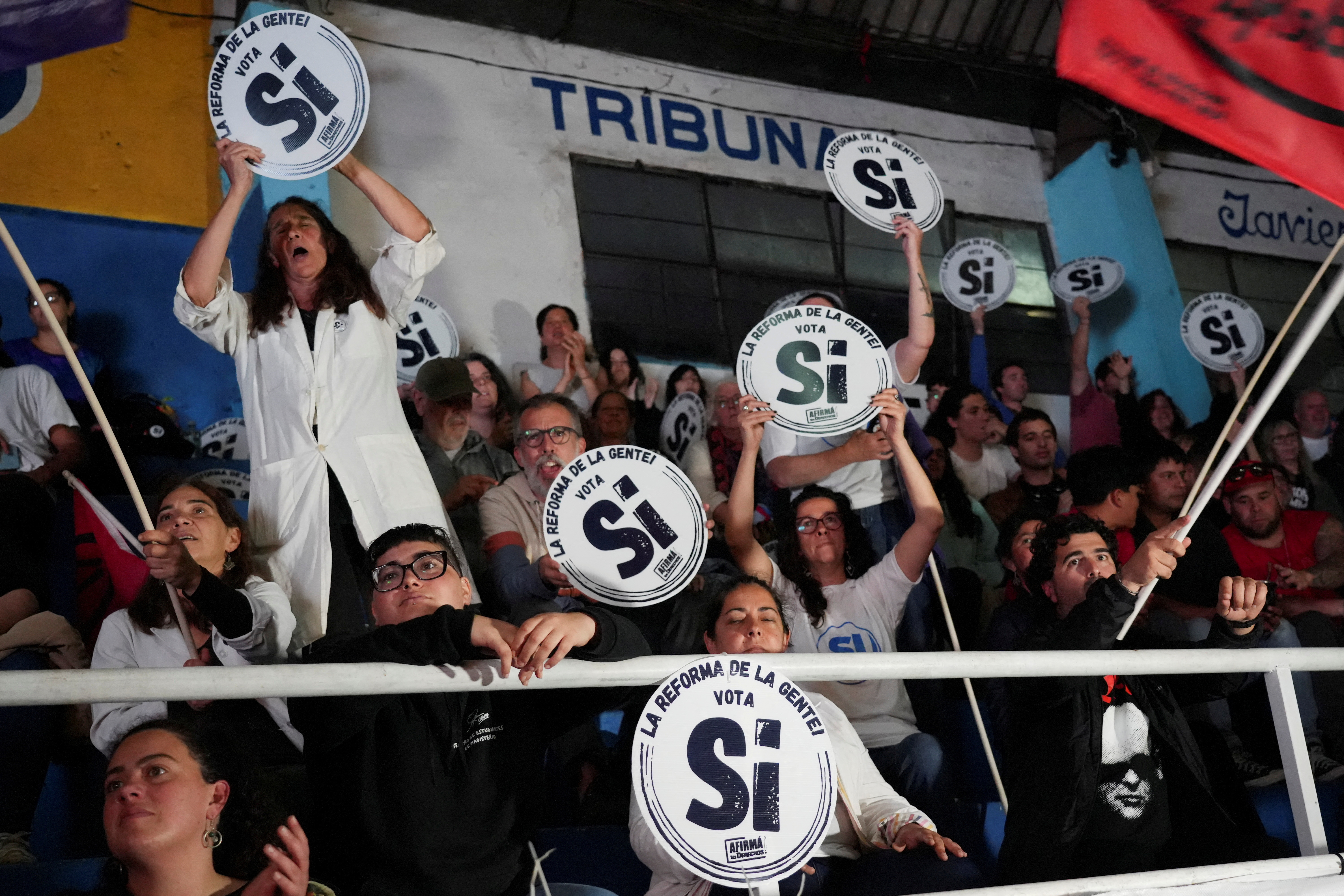 FILE PHOTO: Supporters of a referendum that seeks to push back retirement age from 65 to 60 attend a closing rally in Montevideo