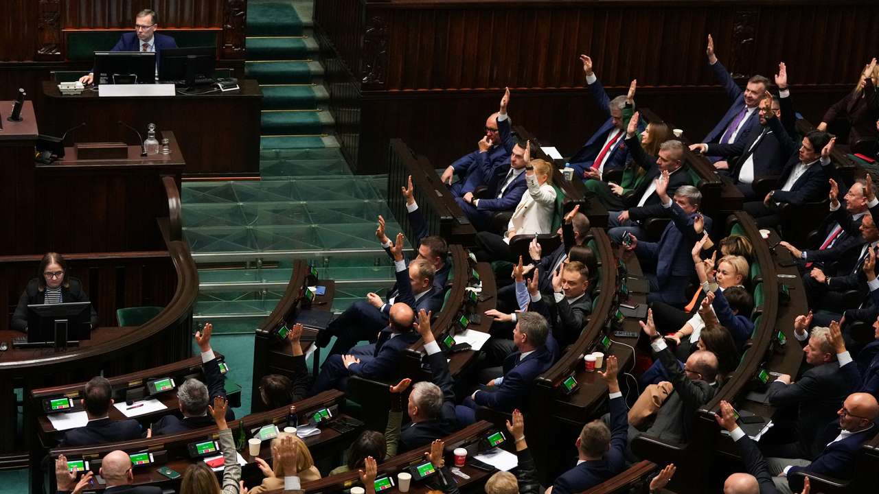 Members of the Polish Parliament vote in favor of newly appointed Polish Prime Minister Donald Tusk's government, in Parliament, in Warsaw