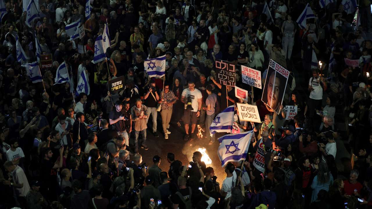 People attend a protest calling for the immediate release of hostages, in Tel Aviv