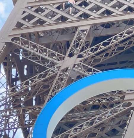 Man climbs Eiffel Tower on Olympics' last day