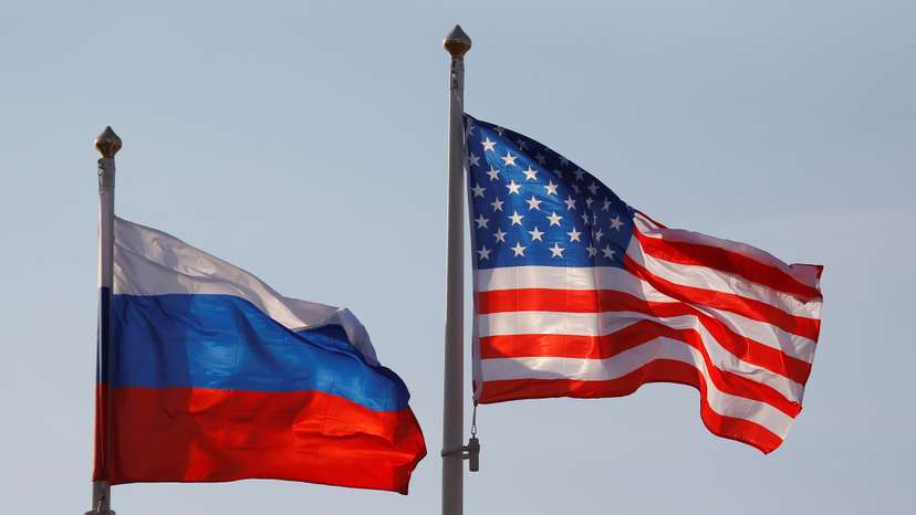 National flags of Russia and U.S. fly at Vnukovo International Airport in Moscow