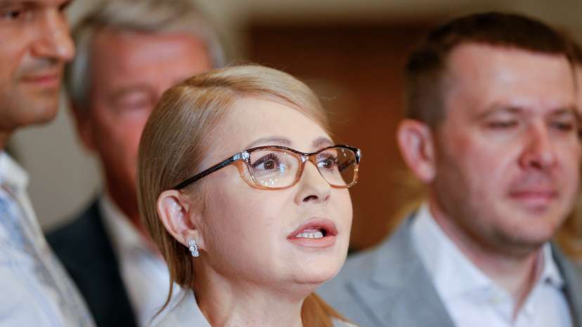 Batkivshchyna party leader Tymoshenko visits a polling station during Ukraine's parliamentary election in Kiev