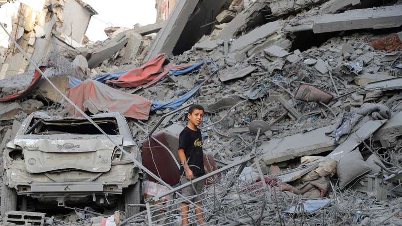 Palestinians inspect the site of Israeli strikes on houses at Shati (Beach) refugee camp in Gaza City