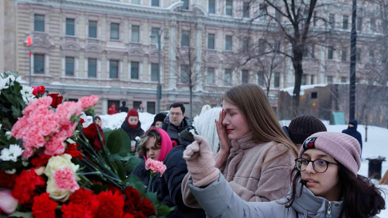 People lay flowers in memory of Alexei Navalny in Moscow