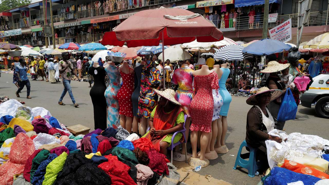 FILE PHOTO: People trade in Accra