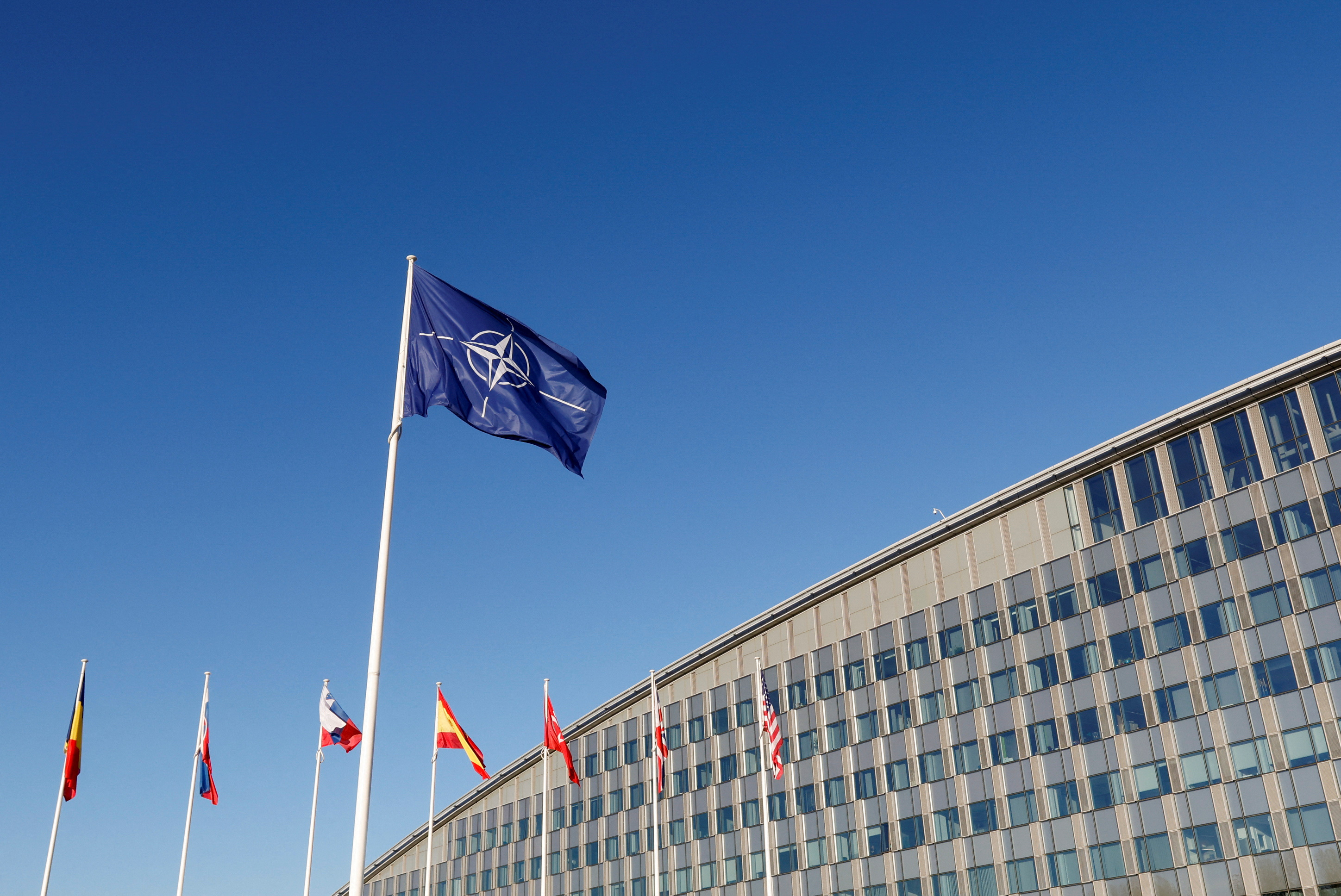 Flags fly outside NATO headquarters in Brussels