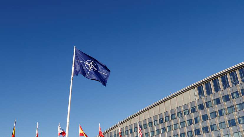 Flags fly outside NATO headquarters in Brussels