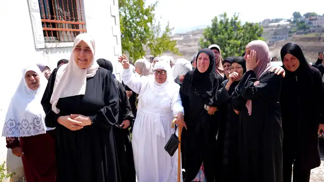 HIJJA, WEST BANK, PALESTINE - SEPTEMBER 7: Palestinians mourn as they attend the funeral of Omar al-Tubas in the village of Hijja, east of Qalqilya in the northern West Bank, Palestine on September 7, 2026. The young Palestinian man died after being shot in the head when Israeli settlers raided the village. Tensions and violence across the territory continue to escalate as local residents gathered to accompany al-Tubas to his final resting place.