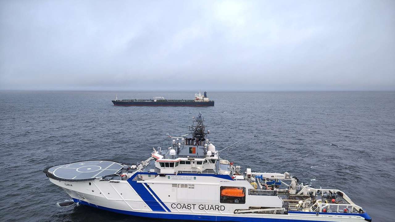 Finnish Border Guard's ship Turva and oil tanker Eagle S sail on the sea outside the Porkkalanniemi, Finland