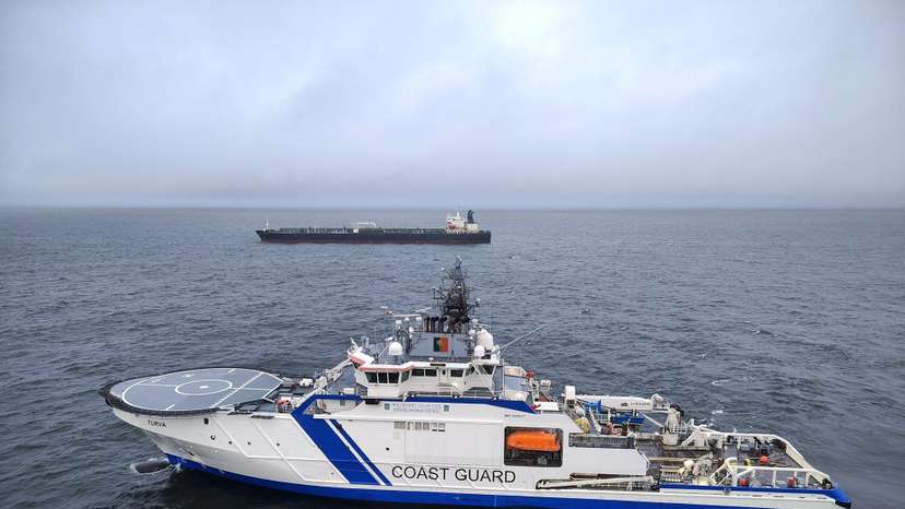 Finnish Border Guard's ship Turva and oil tanker Eagle S sail on the sea outside the Porkkalanniemi, Finland
