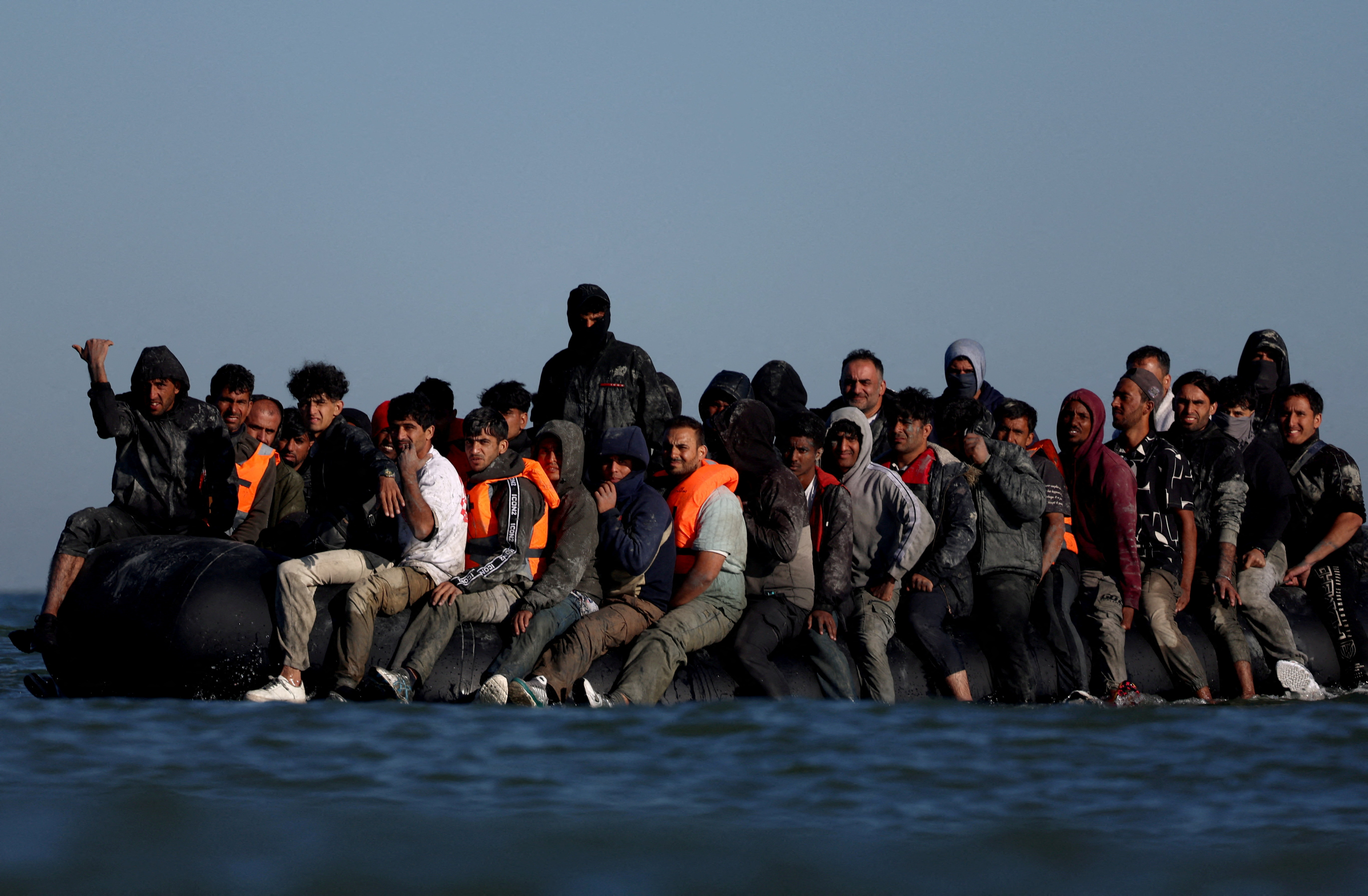FILE PHOTO: Migrants attempt to cross the English channel from northern France