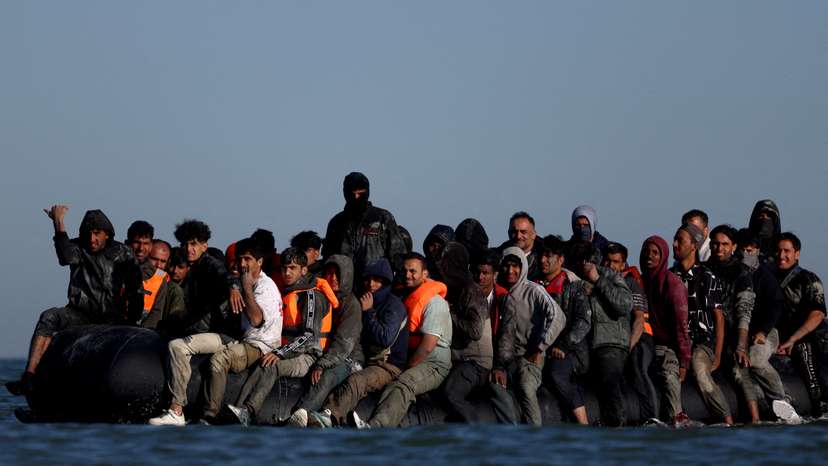 FILE PHOTO: Migrants attempt to cross the English channel from northern France