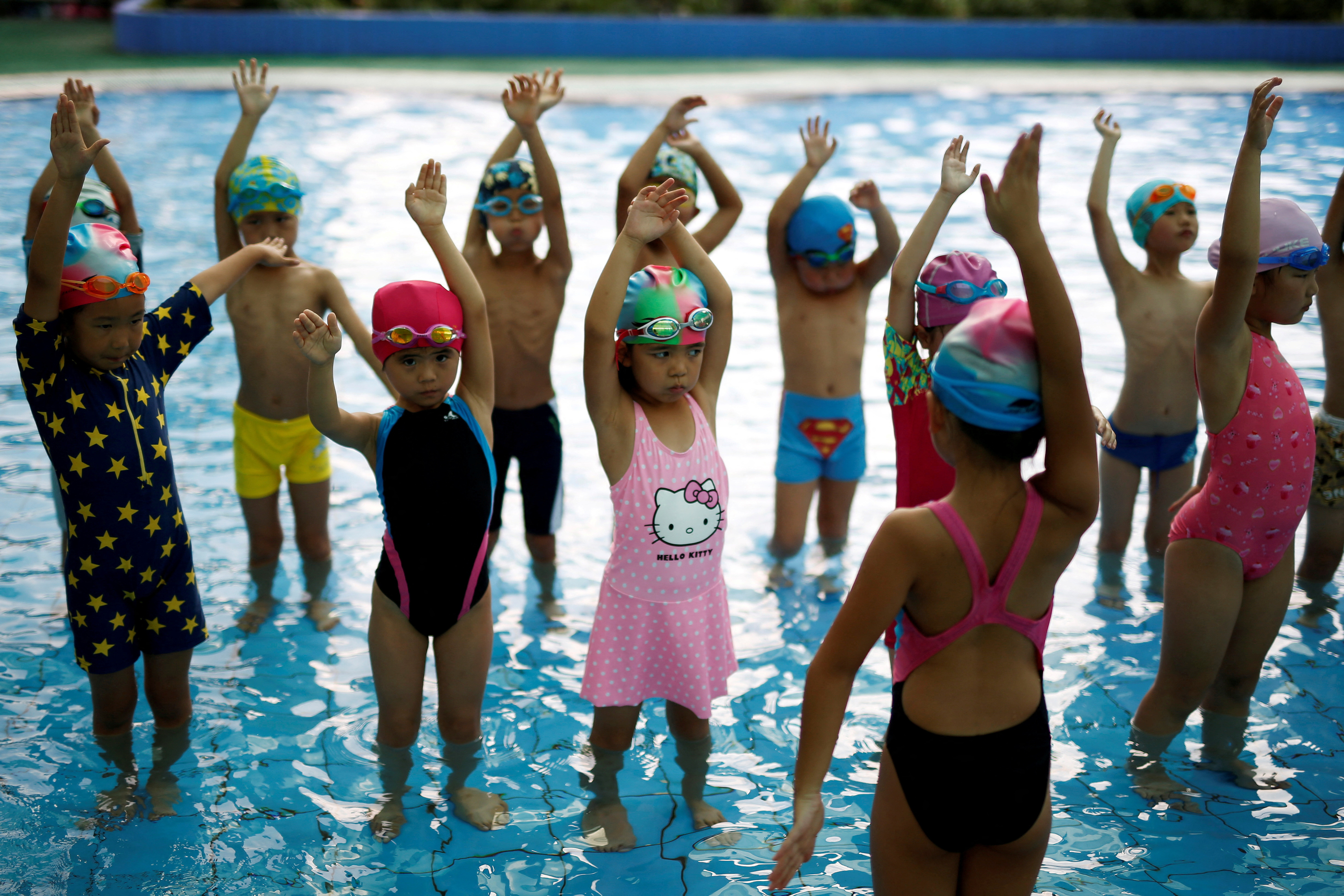 FILE PHOTO: Children attend a swim training session at Hangzhou Chen Jinglun Sport school Natatorium, where Chinese Olympic swimmer Sun Yang and Fu Yuanhui also trained, in Hangzhou