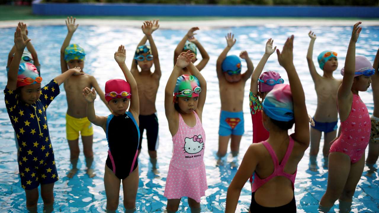 FILE PHOTO: Children attend a swim training session at Hangzhou Chen Jinglun Sport school Natatorium, where Chinese Olympic swimmer Sun Yang and Fu Yuanhui also trained, in Hangzhou