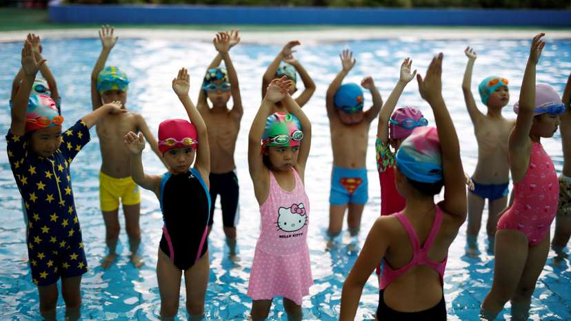 FILE PHOTO: Children attend a swim training session at Hangzhou Chen Jinglun Sport school Natatorium, where Chinese Olympic swimmer Sun Yang and Fu Yuanhui also trained, in Hangzhou
