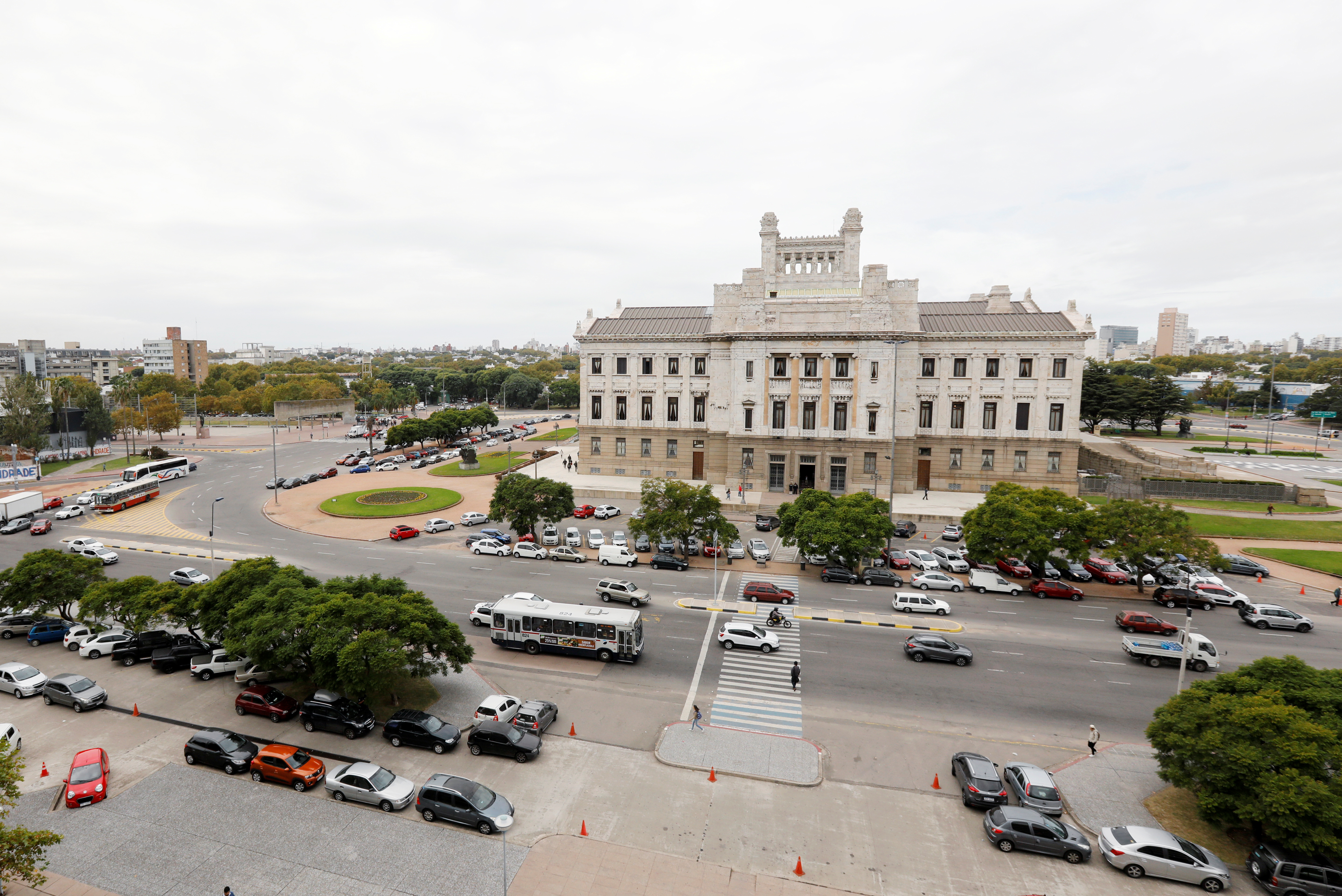 People walk in front of Uruguay's Palacio Legislativo in Montevideo