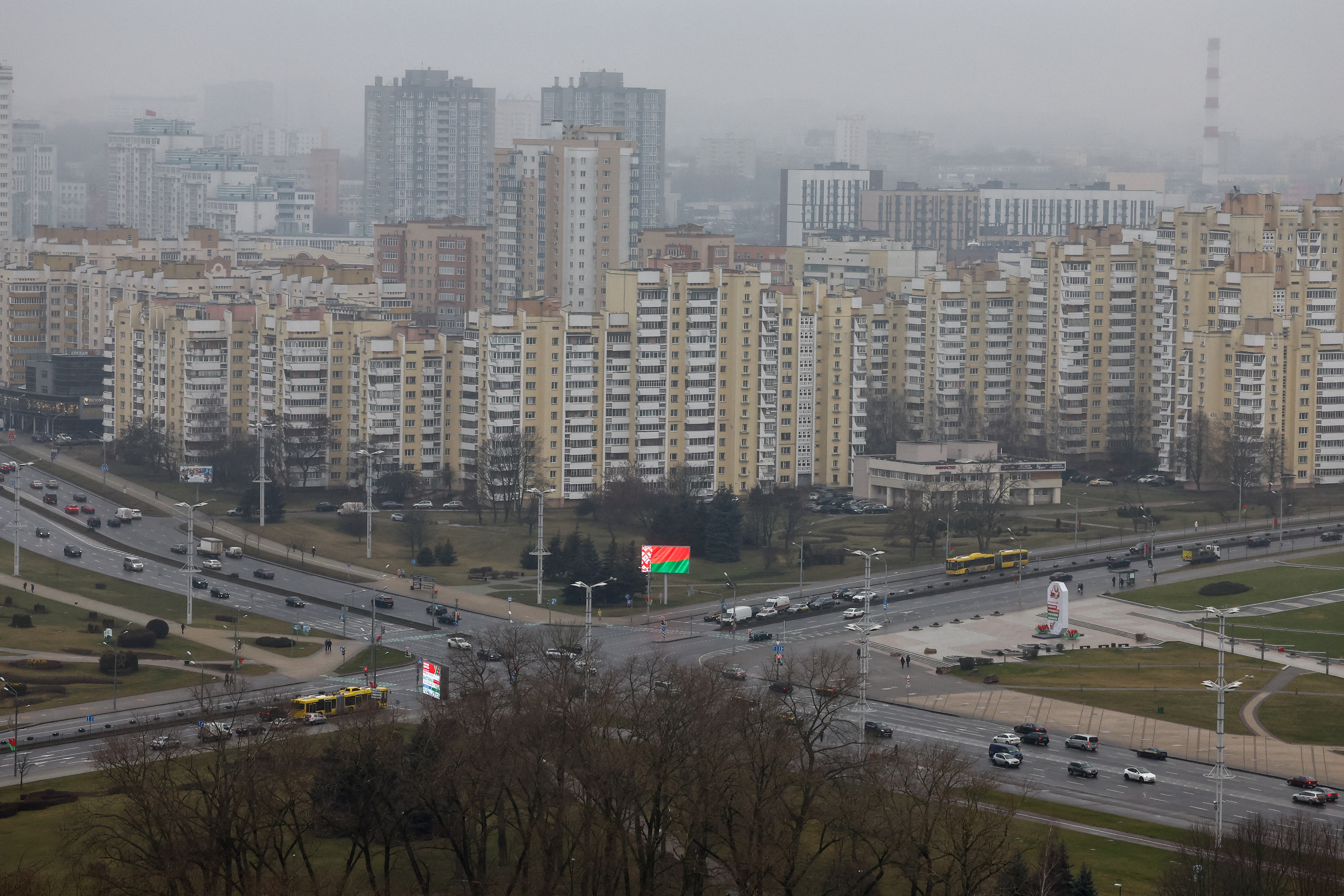 A view of a screen showing the Belarusian national flag in downtown Minsk