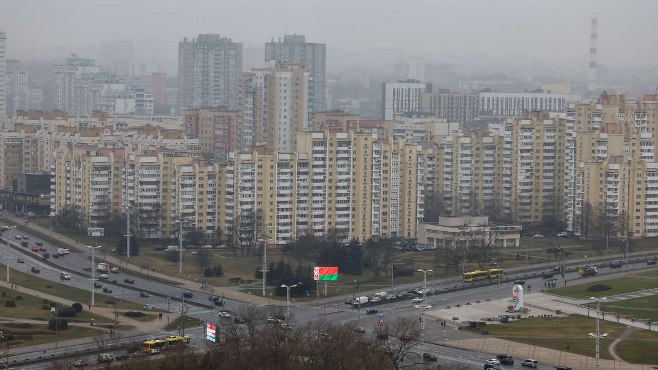 A view of a screen showing the Belarusian national flag in downtown Minsk