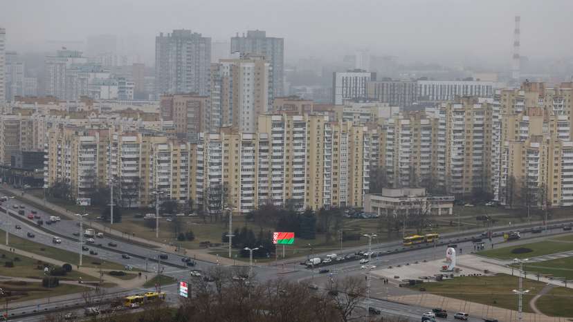 A view of a screen showing the Belarusian national flag in downtown Minsk
