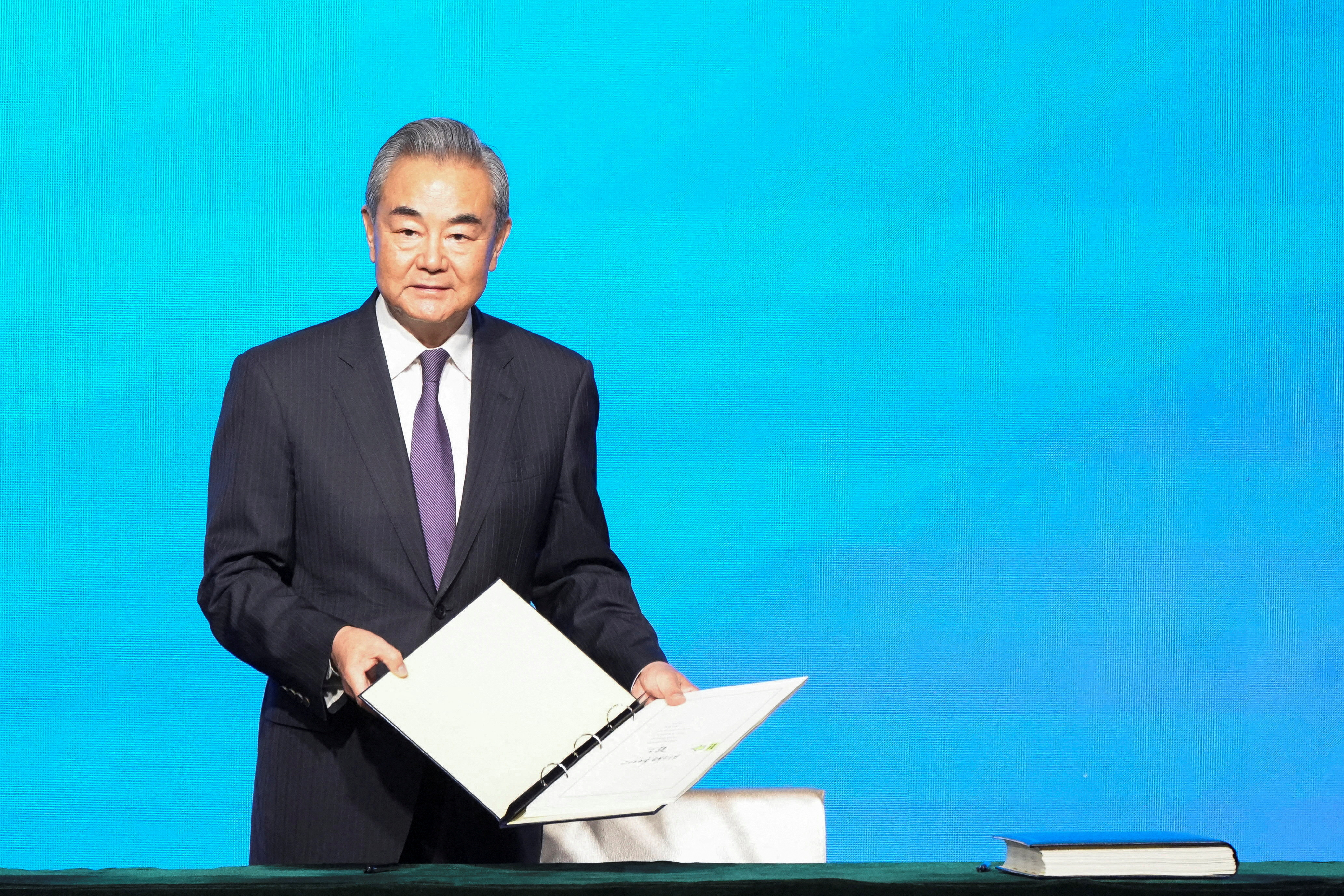 Chinese Foreign Minister Wang Yi attends the signing ceremony of the Convention on the Establishment of The International Organization for Mediation (IOMed) in Hong Kong