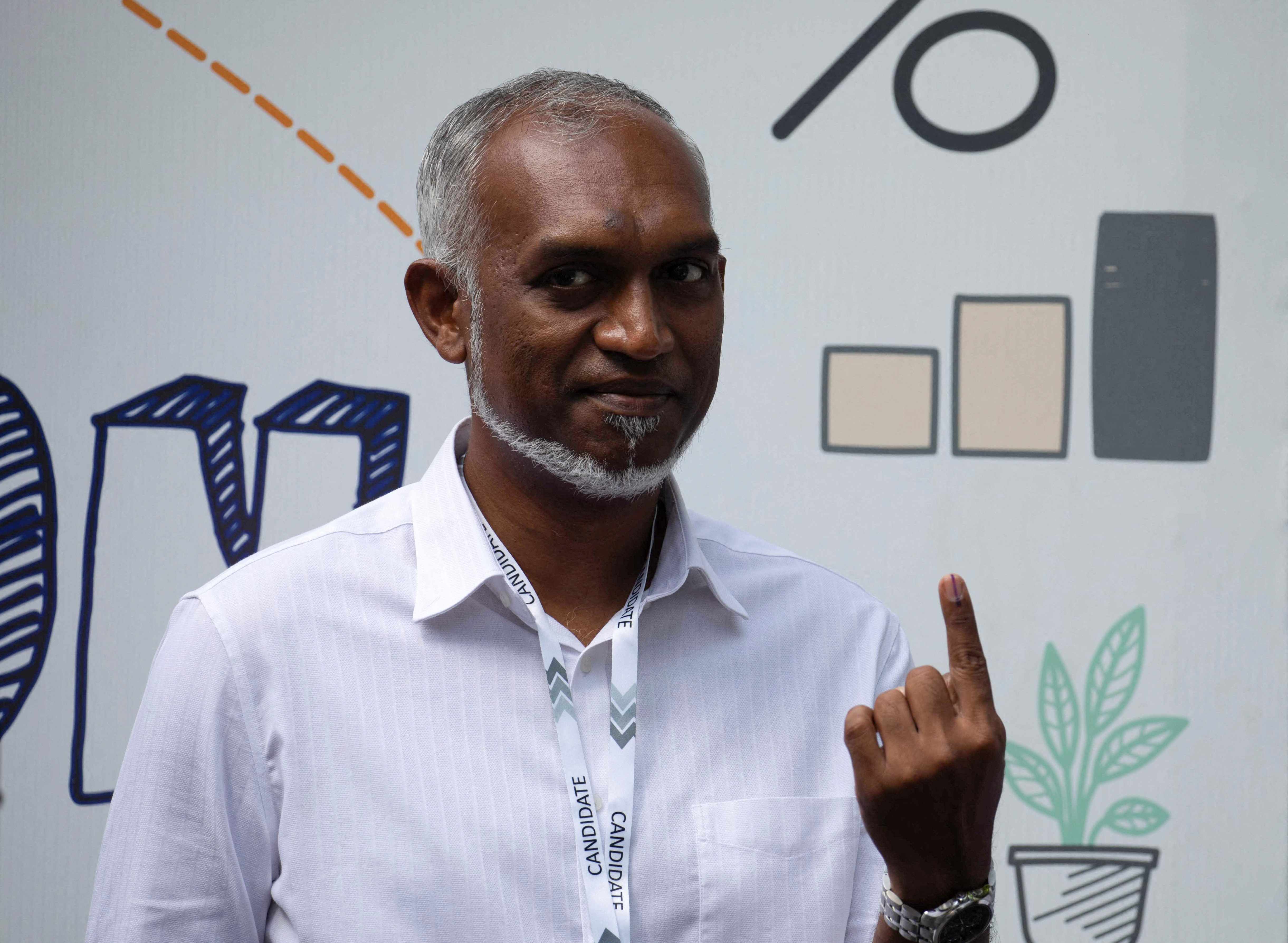 FILE PHOTO: Mohamed Muizzu, Maldives presidential candidate of the opposition party, People's National Congress gestures after casting his vote at a polling station during the Maldives presidential election day in Male, Maldives September 9, 2023. REUTERS/Dhahau Naseem/File Photo