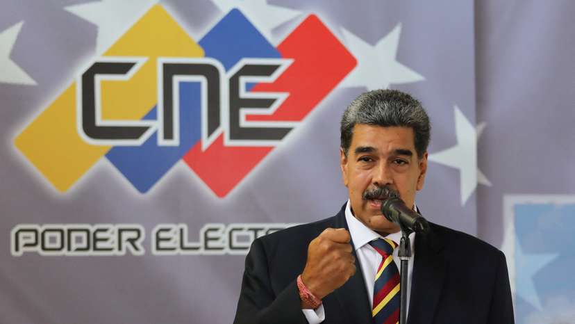 Venezuela's President Nicolas Maduro signs an agreement to recognize the electoral results of the presidential elections of July 28, in Caracas