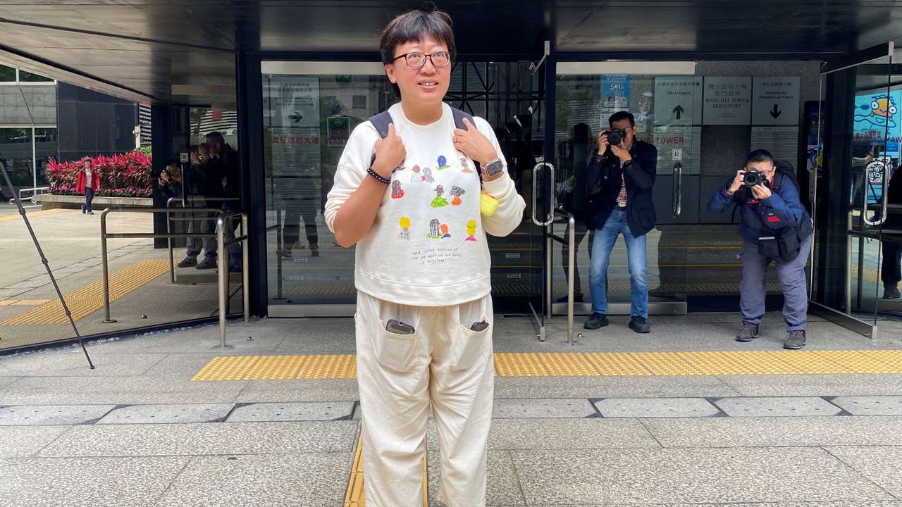 Social worker Jackie Chen Hung-sau arrives at the district court, in Hong Kong