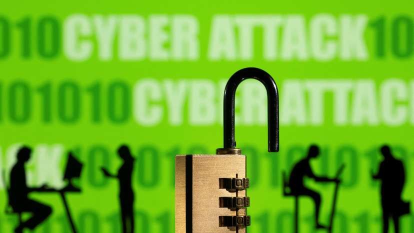 Illustration shows displayed CYBER ATTACK words and binary code