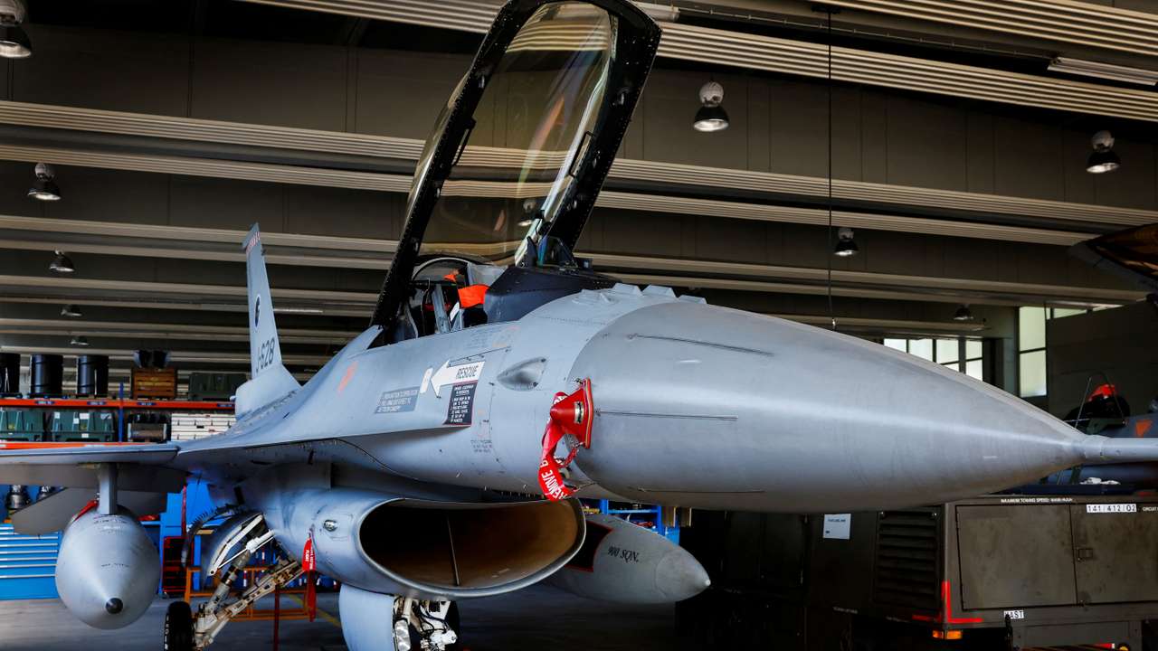 An F-16 fighter jet is seen at a maintenance hangar in Volkel