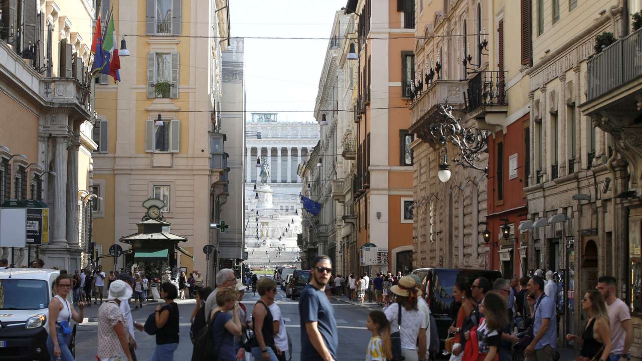 People cross the street in Rome