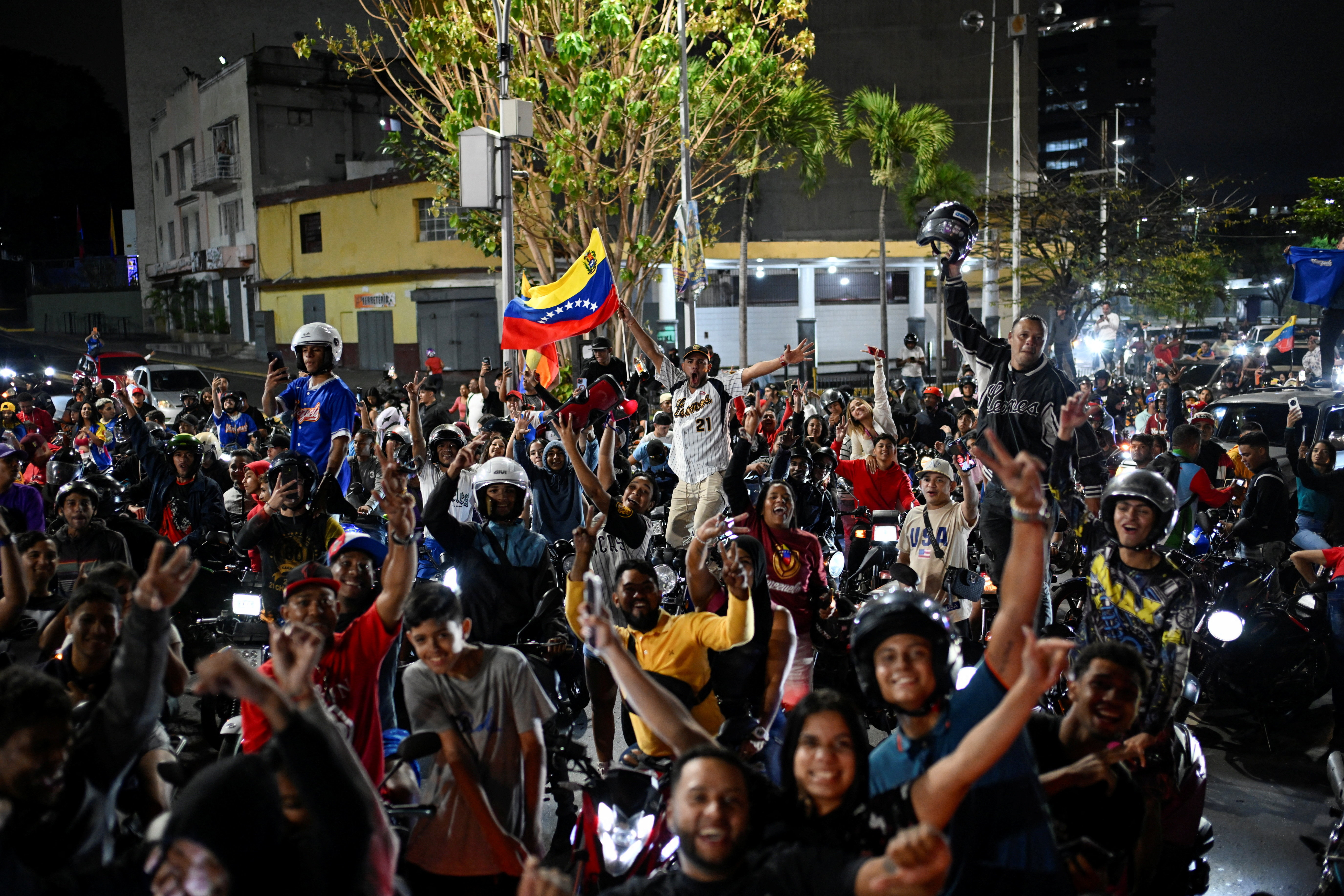 People celebrate Venezuela's victory over the U.S. in the World Baseball Classic final in Caracas