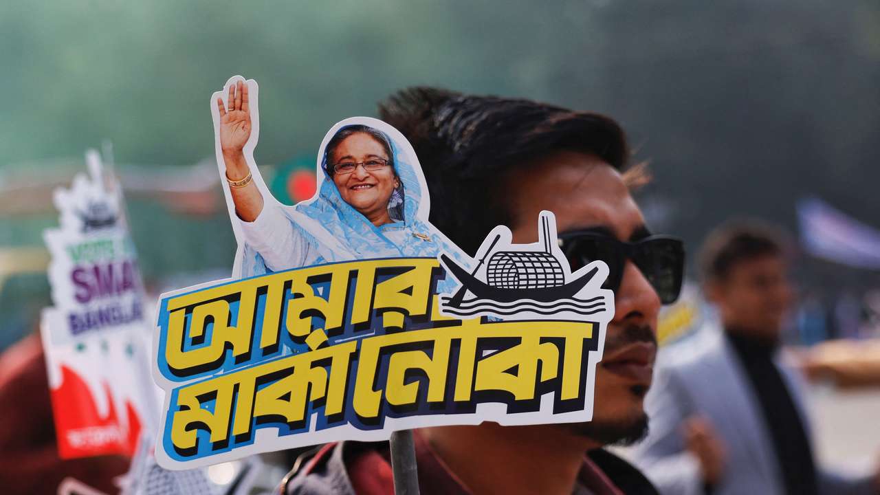 A student holds a placard of Prime Minister Sheikh Hasina as they celebrate the formation day of Bangladesh Chhatra League, in Dhaka