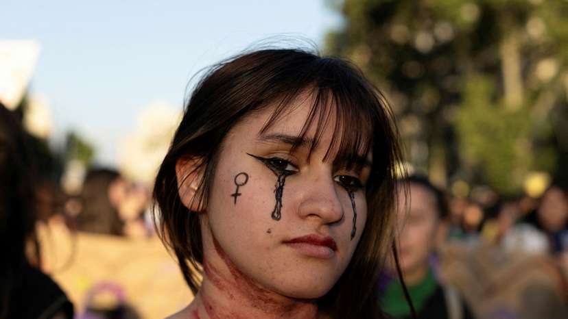 FILE PHOTO: Demonstrators protest to mark the International Day for the Elimination of Violence against Women, in Santiago