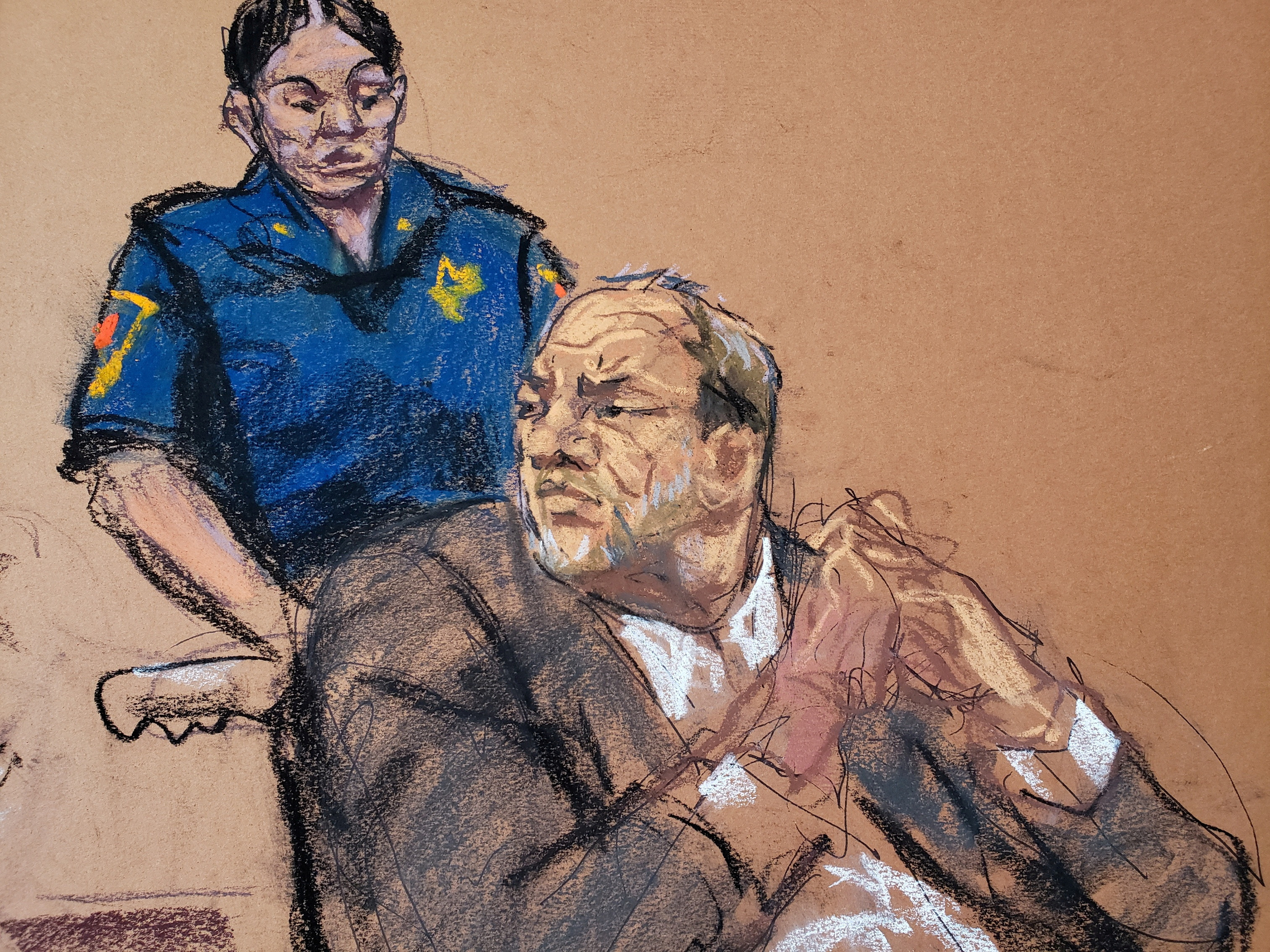 FILE PHOTO: Harvey Weinstein watches as Jessica Mann makes a statement during the sentencing following his conviction on sexual assault and rape charges