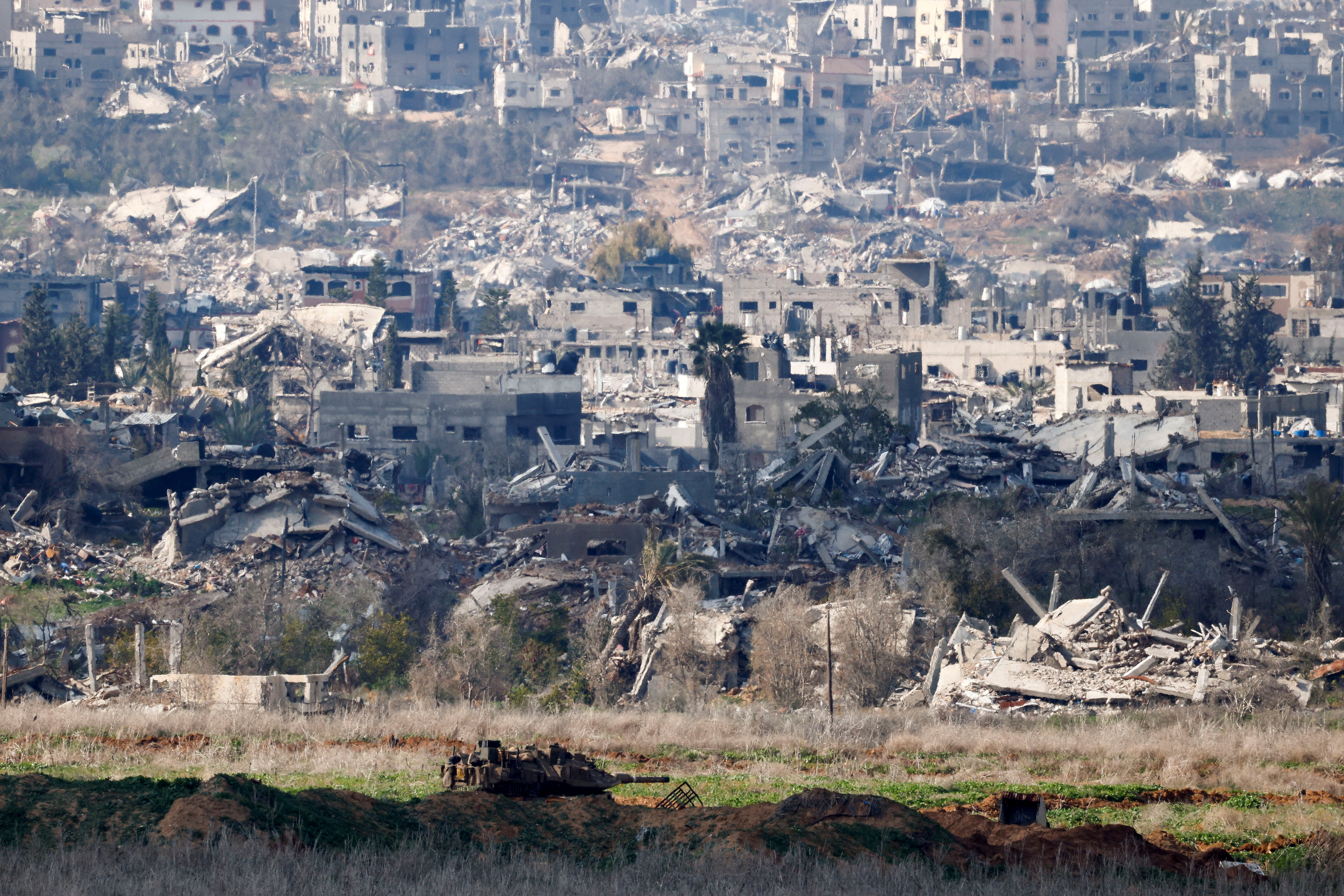 An Israeli tank stands inside Gaza, amid a ceasefire between Israel and Hamas