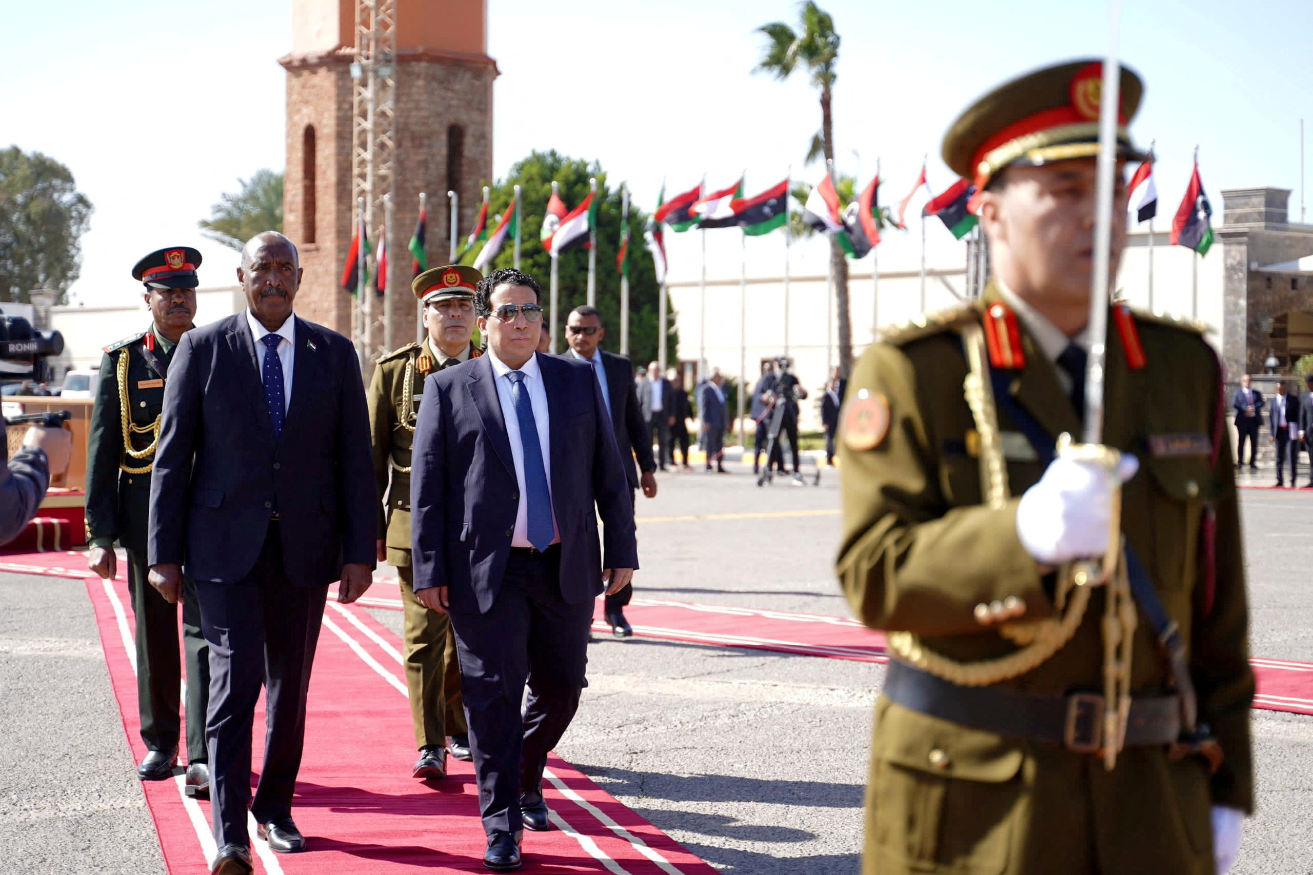 FILE PHOTO: Head of the Libyan Presidential Council Mohamed al-Menfi meets Sudan's Sovereign Council Chief General Abdel Fattah Al-Burhan in Tripoli