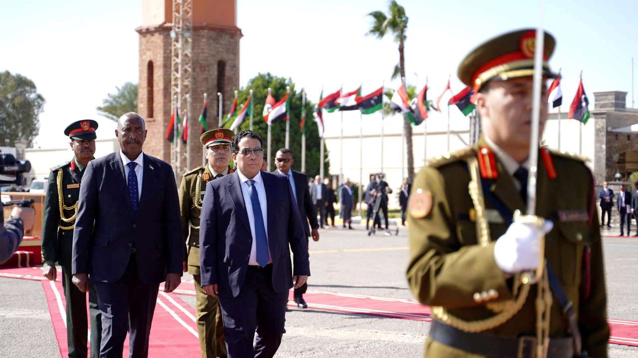 FILE PHOTO: Head of the Libyan Presidential Council Mohamed al-Menfi meets Sudan's Sovereign Council Chief General Abdel Fattah Al-Burhan in Tripoli