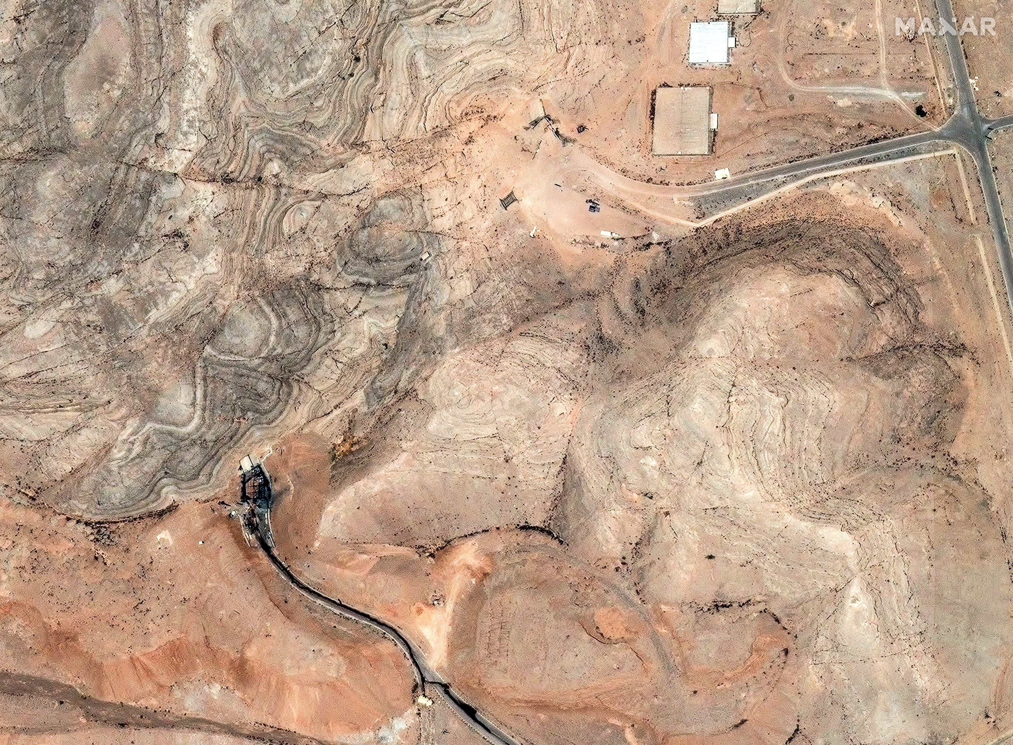 A satellite image shows damage to the tunnel entrances of the Isfahan Nuclear Technology Research Center